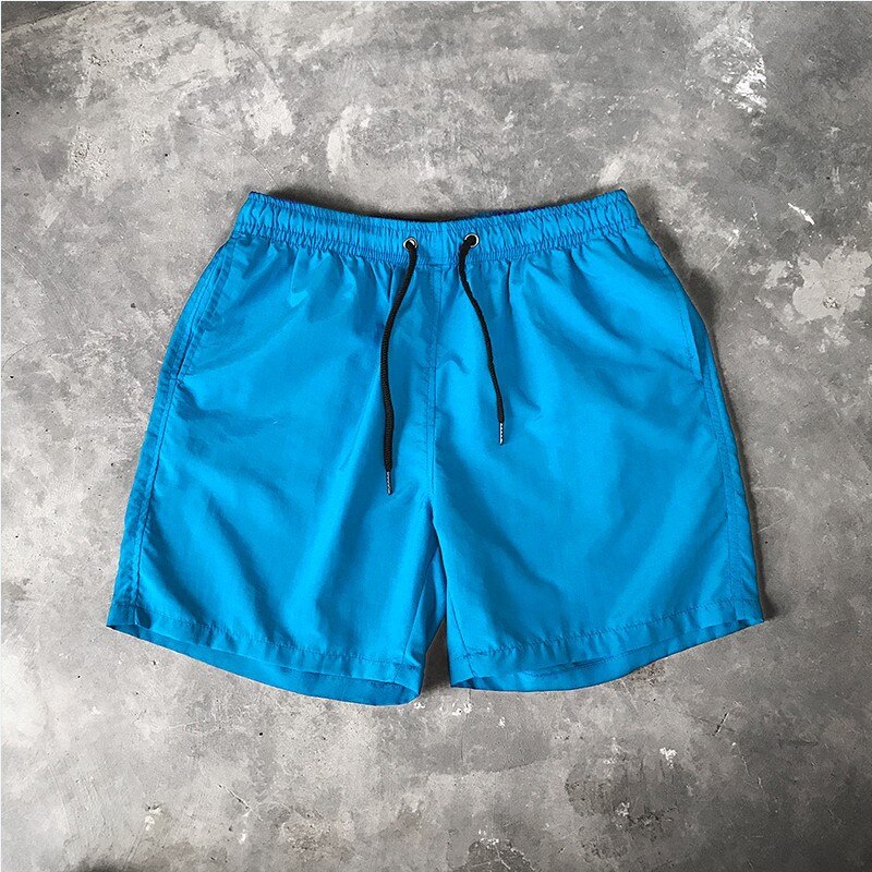 Męskie szorty kąpielowe w jednolitym kolorze - Niebieski / S