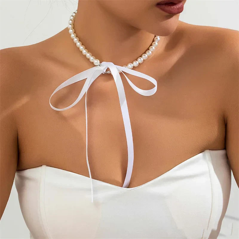 Choker perełkowy z kokardką
