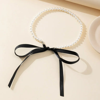 Choker perełkowy z kokardką