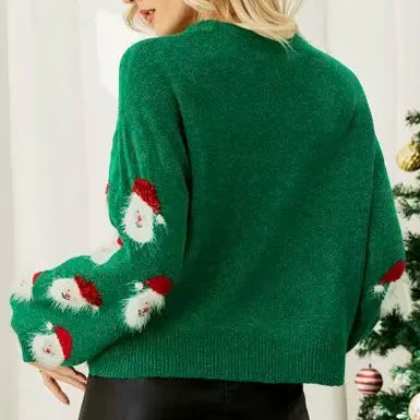 Świąteczny sweter z motywem Mikołajów