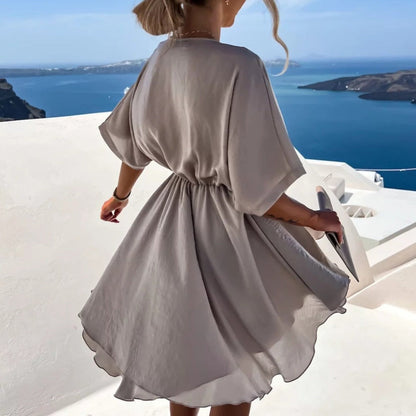 Rozkloszowana sukienka letnia mini z kopertowym dekoltem Ada